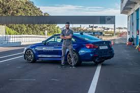 man in a blue car